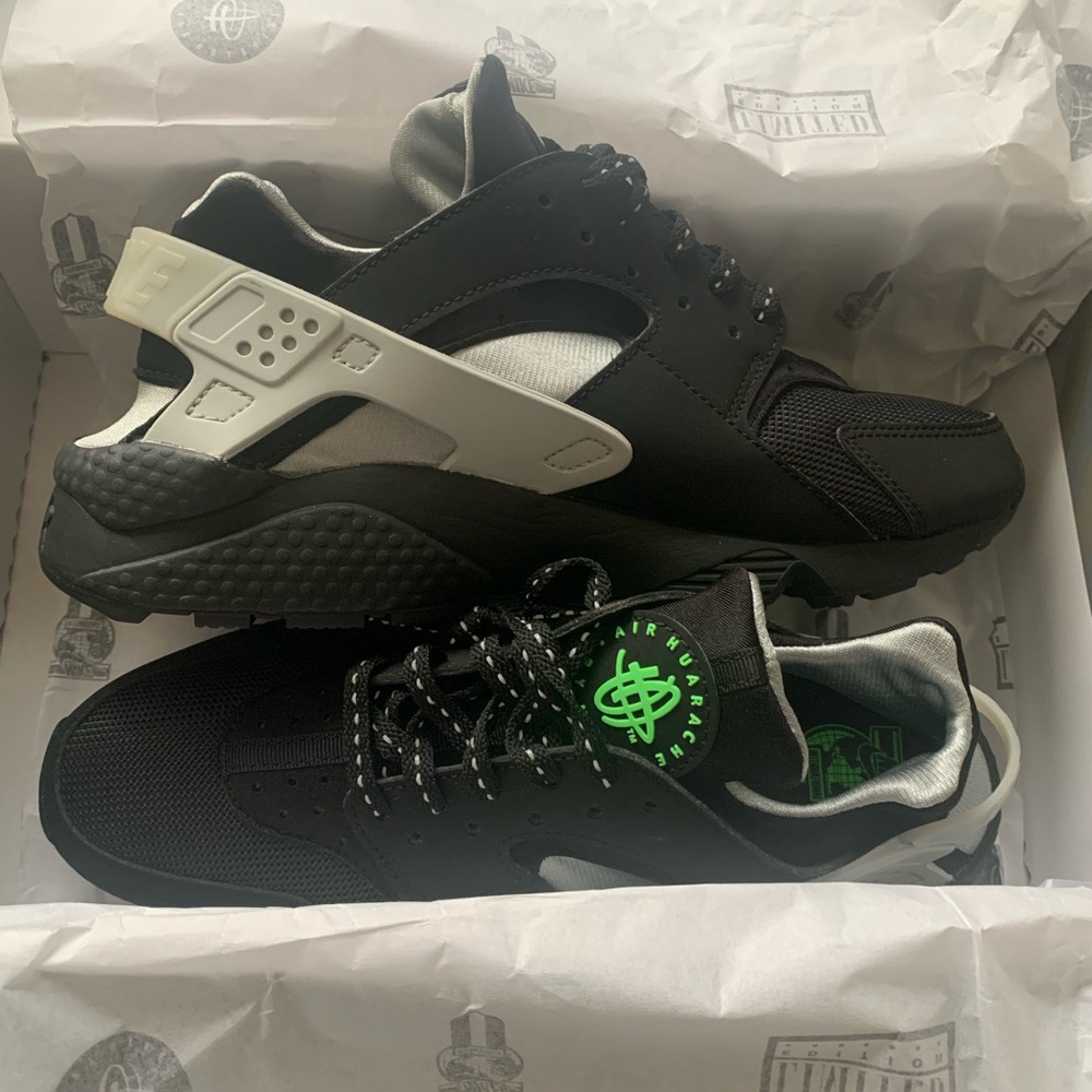 Black and Gray Nike Huaraches with Green Accents